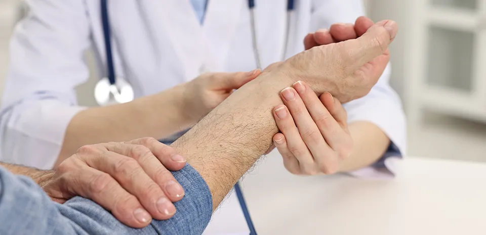 Image of doctor examining a wrist