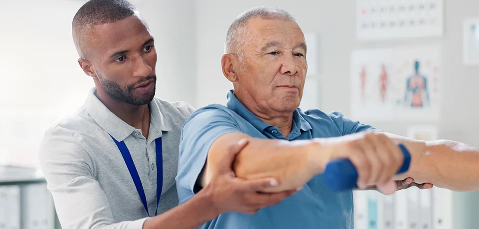 Image of physical therapist working with a patient