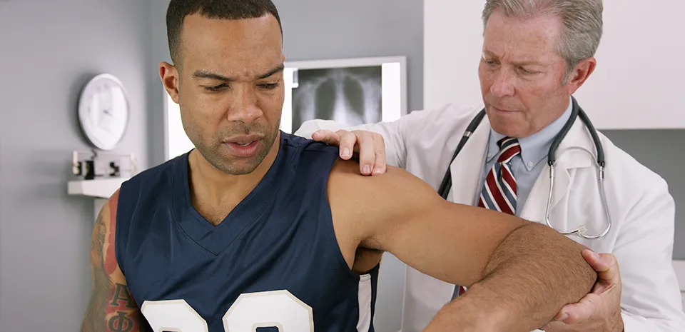 Image of doctor examining an athlete