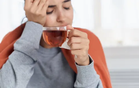 woman with Vomiting, Diarrhea and Dehydration drinking water