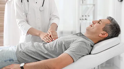 Image of patient on table being examined