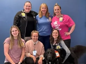 child life specialists group photo with Valentina the dog