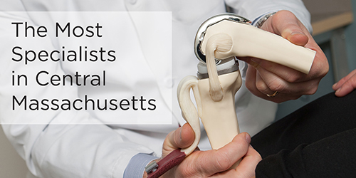 A closeup shows a doctor with a skeletal model and the text 'The Most Specialists in Central Massachusetts.'